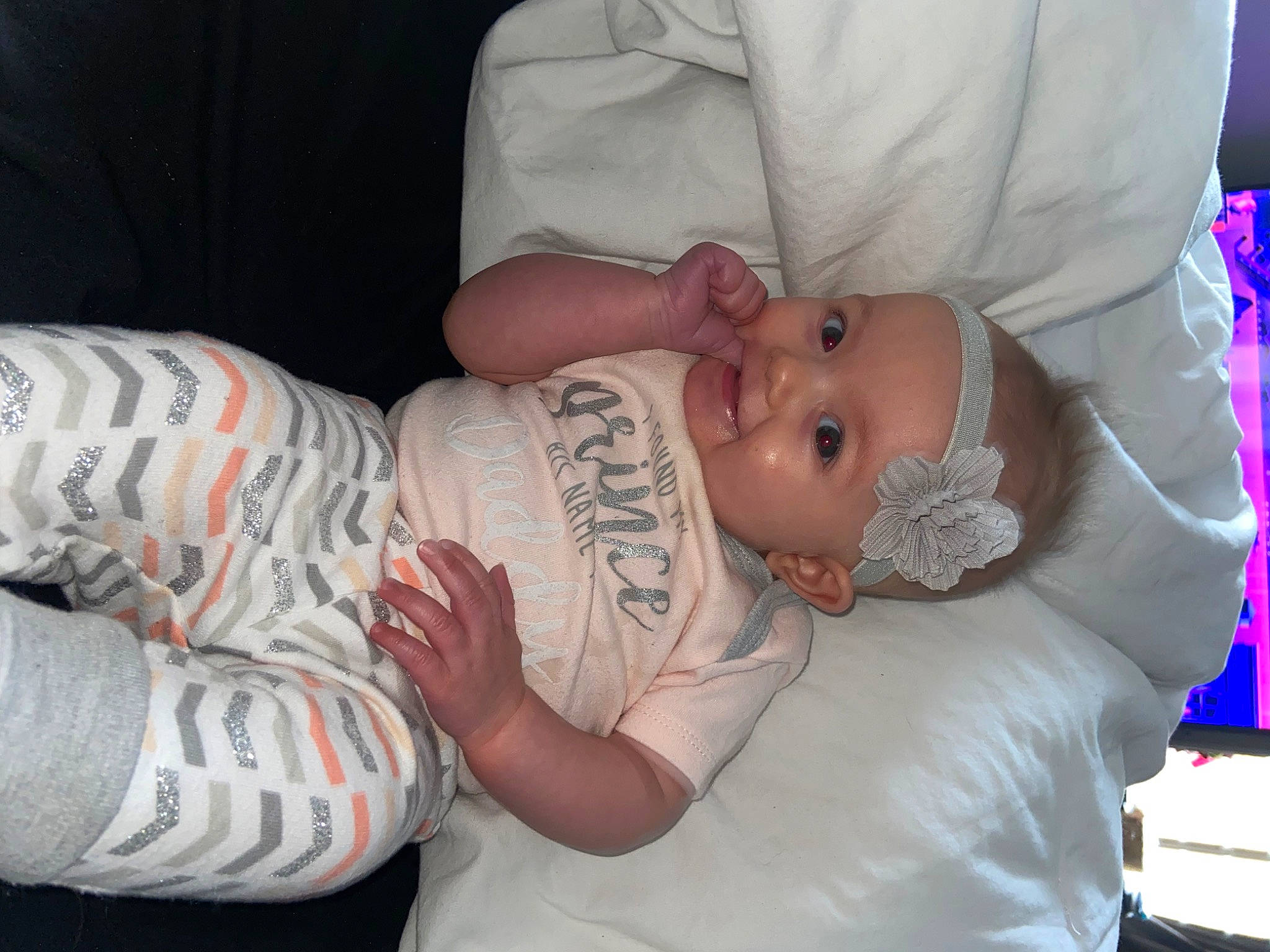 Ila is registered to the contest to win money with this photo: baby, baby_products, baby_toddler_clothing, cheek, child, comfort, elbow, event, eye, face, finger, hat, headwear, human_body, mouth, person, room, skin, sleeve, toddler