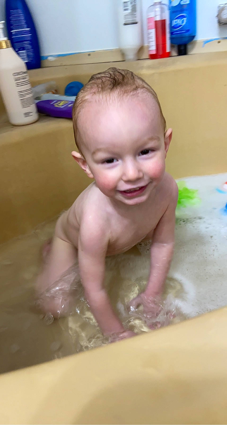 Colton is registered to the contest to win money with this photo: baby, baby_bathing, bathing, bathroom, bathtub, cheek, chest, child, crawling, flooring, fluid, fun, happy, joy, leisure, mouth, person, plumbing, skin, smile