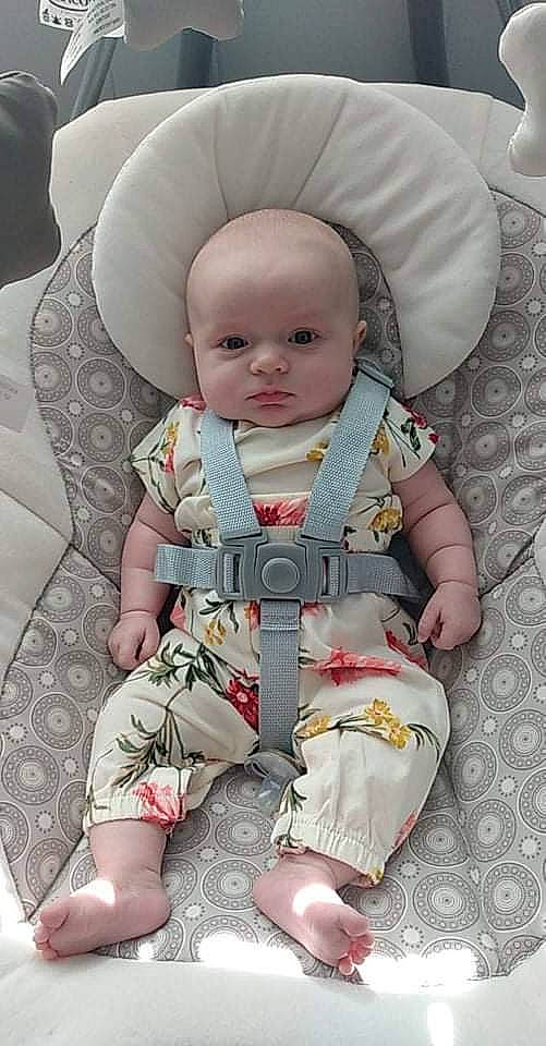 Lorelei is registered to the contest to win money with this photo: baby, baby_products, baby_toddler_clothing, car_seat, chair, cheek, child, comfort, lap, linens, outerwear, pattern, person, pink, product, seat_belt, sitting, skin, sleeve, toddler