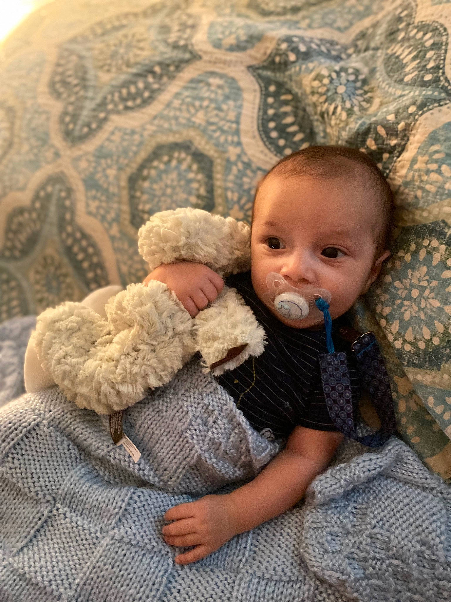 Kyran is registered to the contest to win money with this photo: baby, baby_products, baby_toddler_clothing, cheek, child, comfort, couch, eye, flooring, fur, iris, linens, organ, pattern, person, sitting, skin, textile, toddler, wood