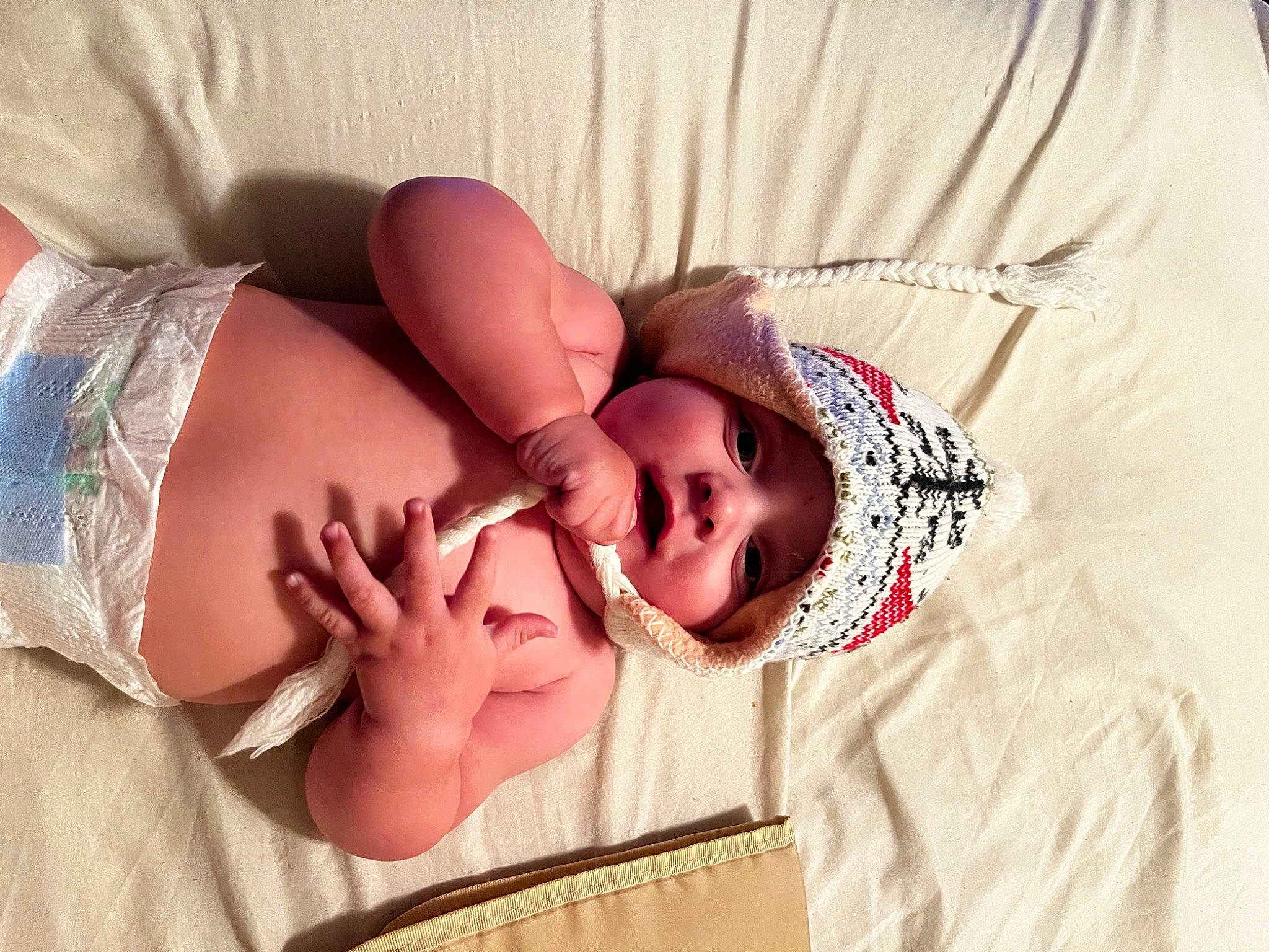 Jaxson is registered to the contest to win money with this photo: abdomen, baby, baby_products, baby_sleeping, baby_toddler_clothing, bed, bedding, bedtime, chest, child, comfort, eye, eyelash, face, happy, headwear, linens, pattern, person, sleep