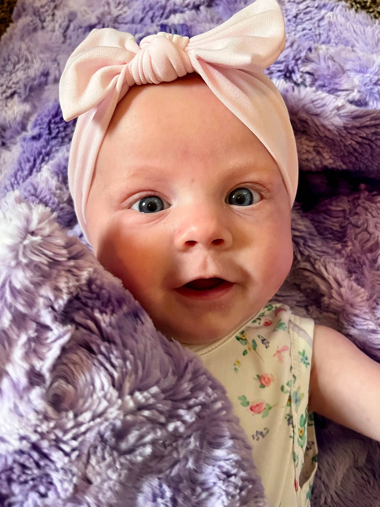 Harlow is registered to the contest to win money with this photo: baby, baby_toddler_clothing, child, costume_hat, eye, eyelash, hair_accessory, happy, hat, headband, headpiece, iris, magenta, person, petal, pink, purple, skin, smile, textile