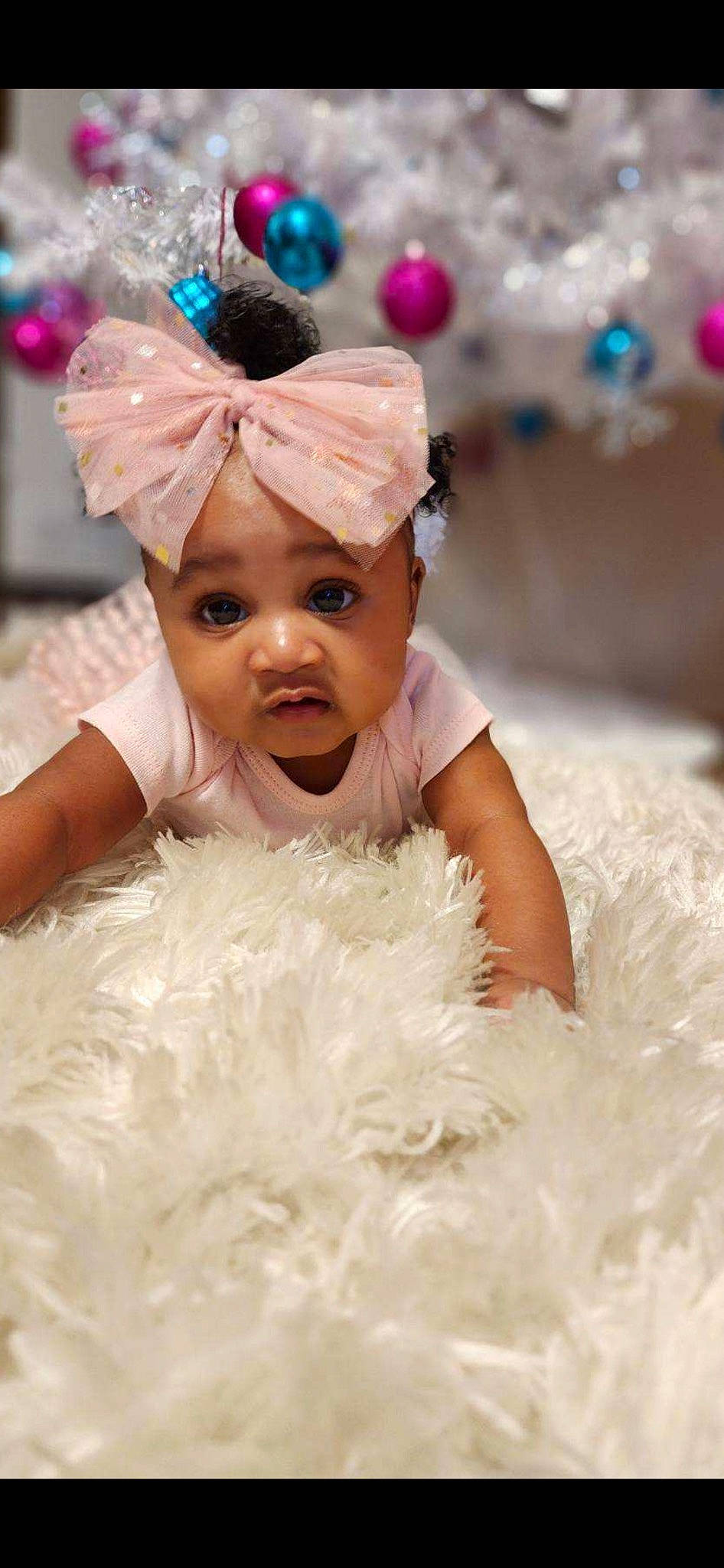 Destiny joined the competition — help win amazing prizes! baby, child, dress, event, eye, finger, fun, gesture, happy, headgear, headpiece, headwear, interaction, person, photograph, pink, skin, smile, textile, toddler