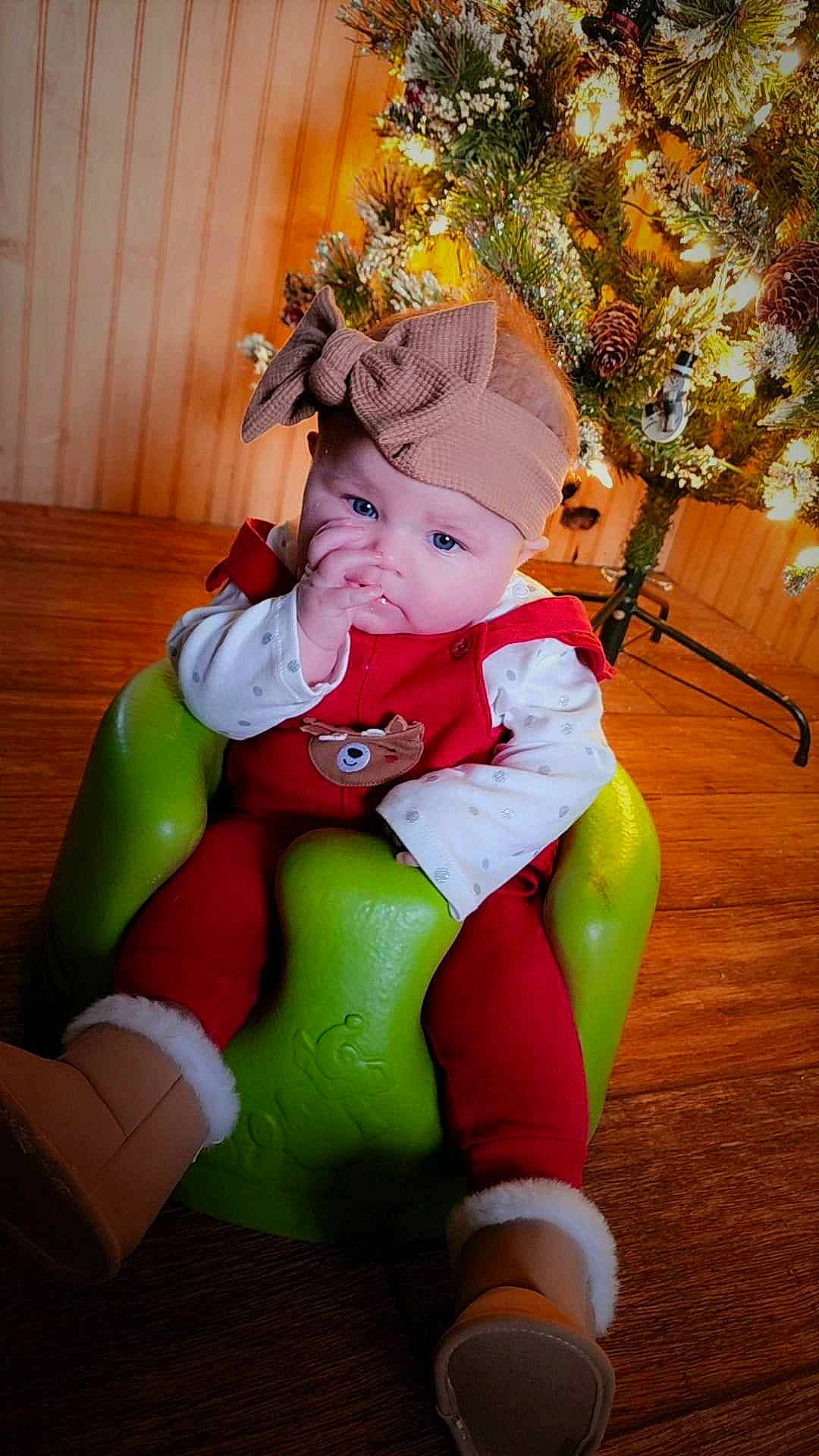 Loretta joined the competition — help win amazing prizes! baby, baby_toddler_clothing, christmas, christmas_decoration, christmas_eve, christmas_ornament, christmas_tree, costume_hat, event, fictional_character, fun, happy, hat, headwear, holiday, holiday_ornament, lap, ornament, person, santa_claus