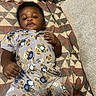 Asante joined the competition — help win amazing prizes! baby, infant, child, teddy_bear, pajamas, blanket, pacifier, patterned_blanket, indoors, sleepwear, cute, lying_down, hand, face, comfort, resting, soft_lighting, relaxation, cozy, portrait