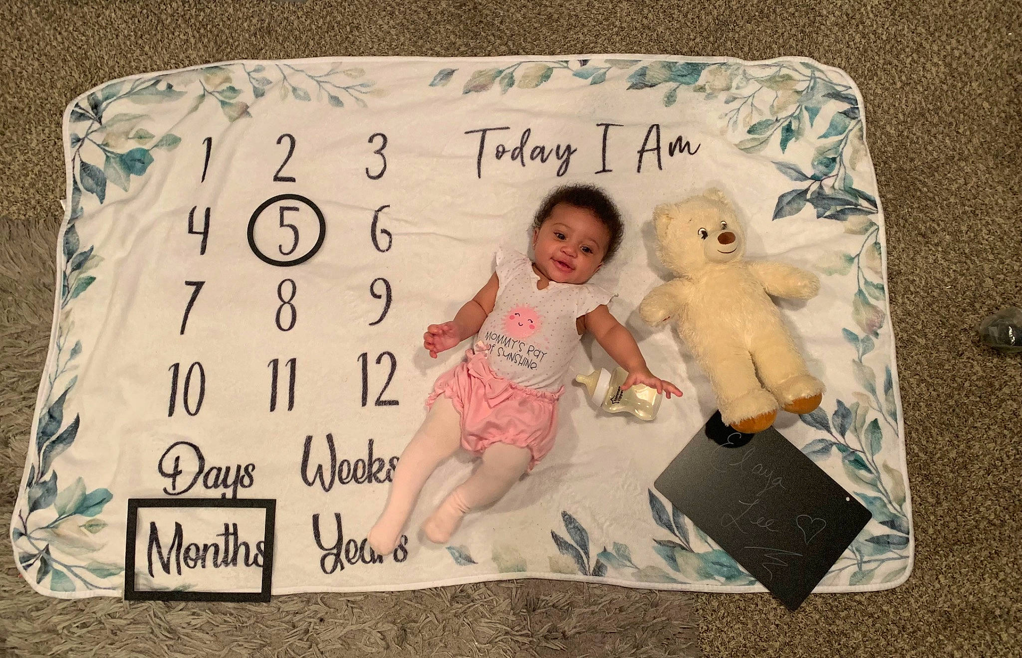 Elaya joined the competition — help win amazing prizes! baby, baby_toddler_clothing, bedding, child, font, handwriting, happy, home_accessories, linens, paper, paper_product, pattern, person, rectangle, room, stuffed_toy, teddy_bear, throw_pillow, toddler