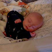 Abel is registered to the contest to win money with this photo: baby, sleeping, blanket, onesie, dinosaur_print, cushion, baby_seat, face, infant, peaceful, cozy, homedecor, soft, resting, child, indoors, pillow, cute, warm, comfort