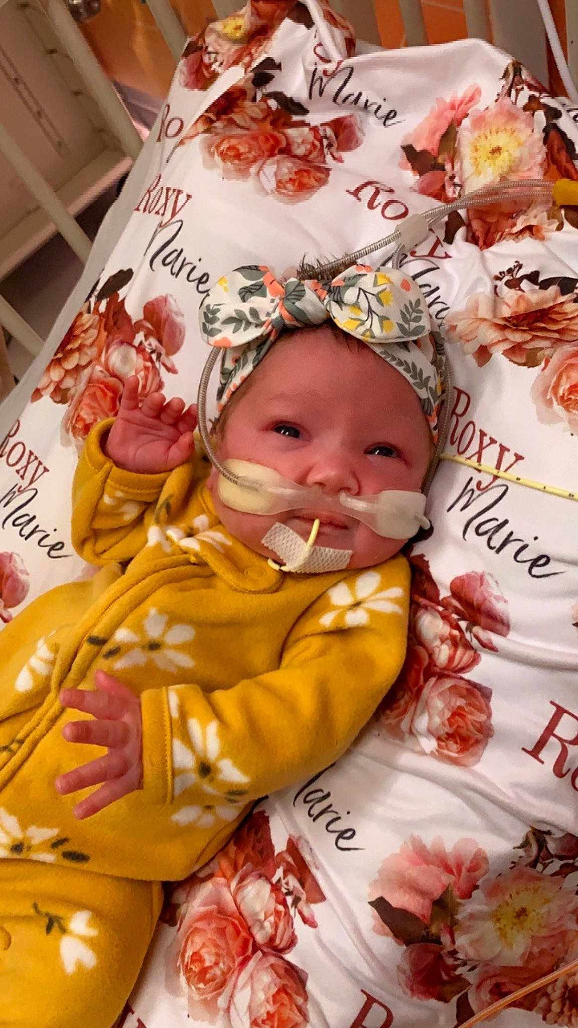 Roxy is registered to the contest to win money with this photo: baby, baby_products, baby_sleeping, baby_toddler_clothing, cheek, child, comfort, event, happy, headwear, linens, pattern, peach, people, person, petal, pink, product, room, skin