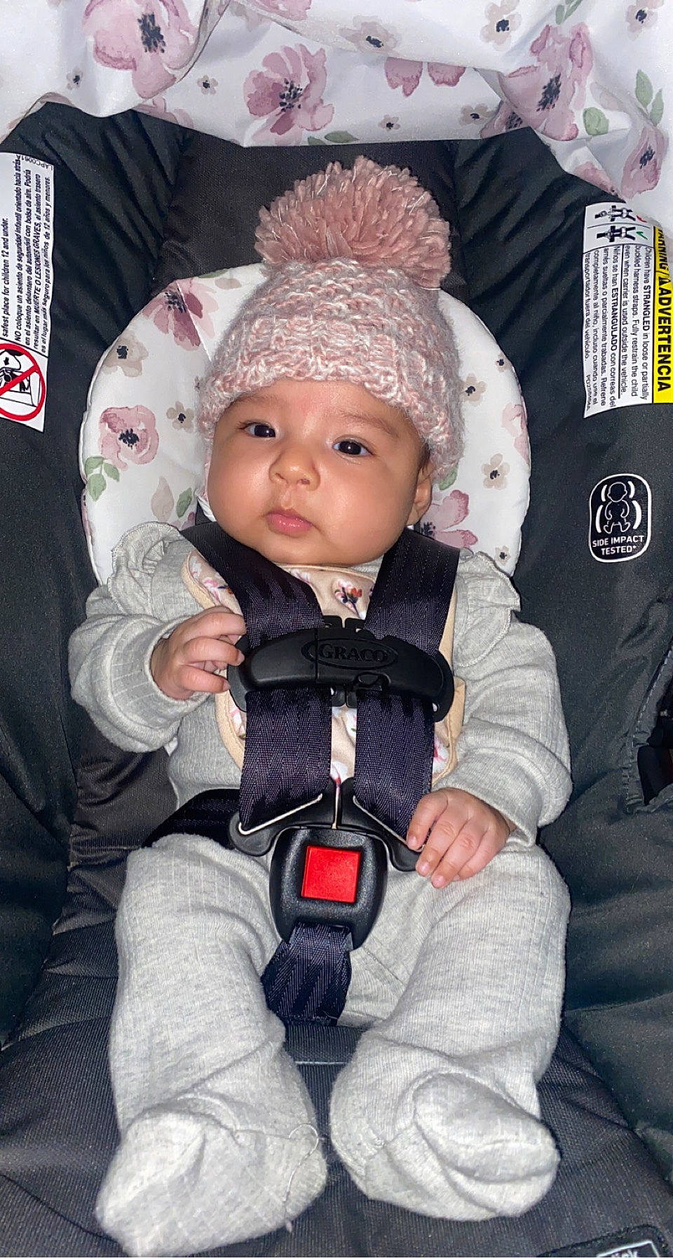 Annalee is registered to the contest to win money with this photo: baby, baby_carriage, baby_products, baby_safety, baby_toddler_clothing, beanie, cap, car_seat, carmine, cheek, child, comfort, eye, fashion_accessory, headwear, knit_cap, person, seat_belt, sitting, textile