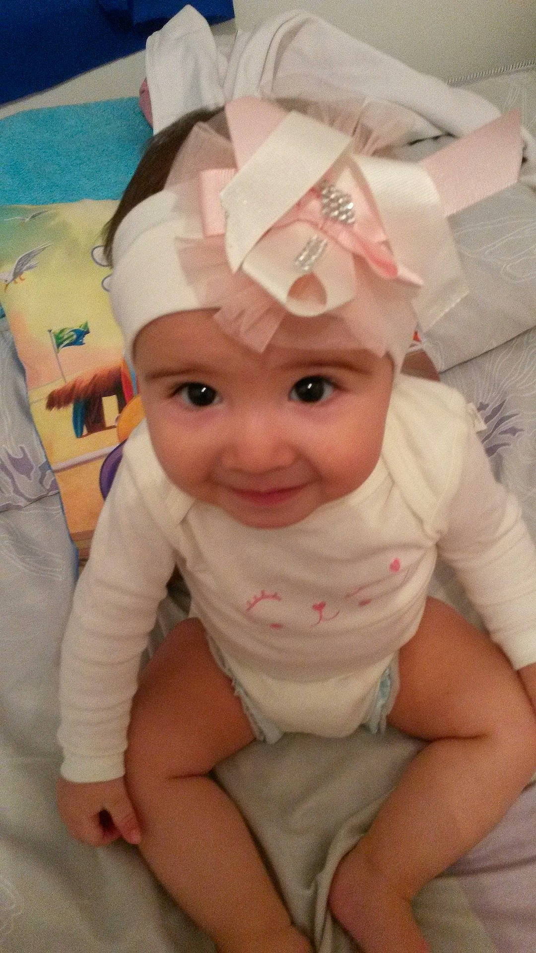 Ela Okyanus participe au concours pour gagner de l'argent avec cette photo : cheek, child, ear, face, girl, hair_accessory, head, headgear, headwear, infant, joy, person, pink, product, skin, toddler