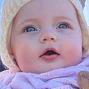 Lucia joined the competition — help win amazing prizes! baby, child, face, hat, knitwear, scarf, pink, cream, blue_eyes, close_up, outdoor, adult, smiling, winter_clothing, portrait, curious_expression, person, headwear, warm_clothing, clear_sky
