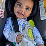 Benjamin is registered to the contest to win money with this photo: baby, child, car_seat, plush_toy, elephant_toy, smiling, happy, infant, clothing, seat_belt, closeup, cute, indoors, person, toddler, hand, face, safety_warning, soft_toy, casual