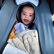 Benjamin joined the competition — help win amazing prizes! baby, smiling, stroller, blanket, toy, child, infant, cozy, cute, happy, face, portrait, clothing, fabric, soft, comfort, outdoor, seat, zippers, head