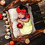baby, sleeping, snow_white_costume, red_bow, yellow_dress, wooden_bed, knit_blanket, apple, toy_figures, seven_dwarfs, floor, wooden_floor, footwear, infant, cute, portrait, fairy_tale, costume, indoor, decor