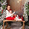Lou a rejoint le concours — aidez-le/la à gagner de superbes lots ! child, baby, swing, holiday, christmas, winter, red_clothing, white_clothing, pine_garland, snow, lantern, smiling, indoor, decorations, festive, portrait, cute, headband, boots, cozy