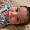 Cassiel joined the competition — help win amazing prizes! baby, infant, child, portrait, face, eyes, wide_eyed, lying_down, bed, blanket, pillow, home, indoor, close_up, brown_hair, blue_clothing, onesie, cozy, photography, cute