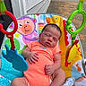 Tayo is registered to the contest to win money with this photo: animal_prints, baby, baby_seat, child, colorful, cute, driveway, foot, hand, house_wall, infant, newborn, onesie, outdoor, peaceful, resting, skin, sleeping, summer, toys