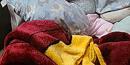 Bayley is registered to the contest to win money with this photo: baby, infant, blanket, couch, pillow, elephant_pattern, child, indoors, cozy, hand, face, person, clothing, sitting, soft, comfort, cute, home, relaxation, pink_pants