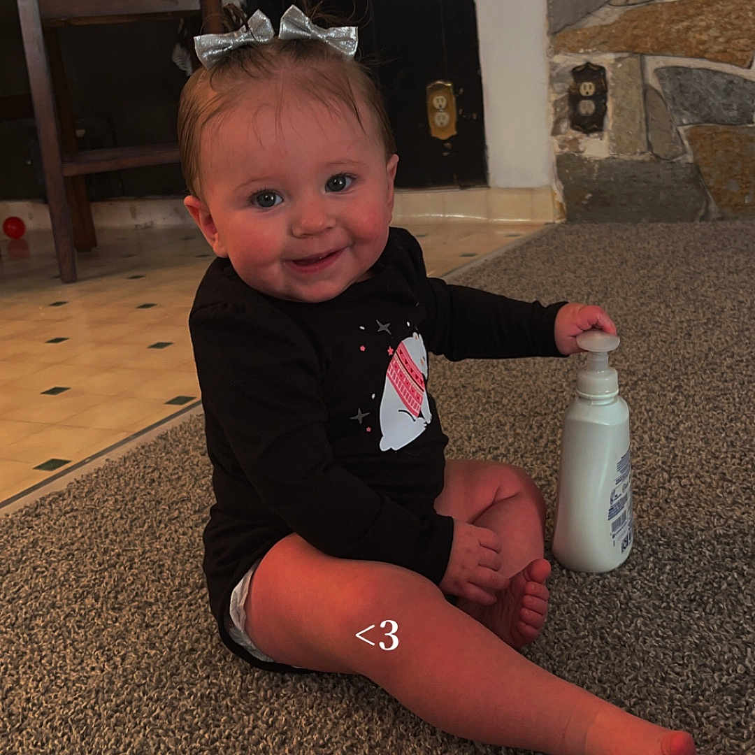 Reignsly joined the competition — help win amazing prizes! accessories, baby, beverage, bodypart, bottle, couch, face, finger, furniture, hand, happy, hardwood, head, milk, person, photography, portrait, sitting, smile, wood