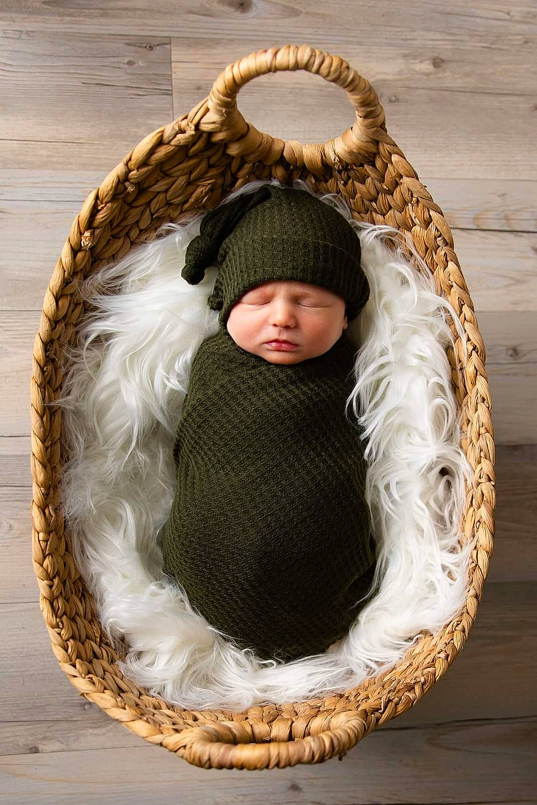 Emmitt joined the competition — help win amazing prizes! art, baby, basket, child, circle, comfort, fashion_accessory, fur, grass, headgear, headwear, natural_material, oval, pattern, person, plant, sitting, twig, wicker, wood