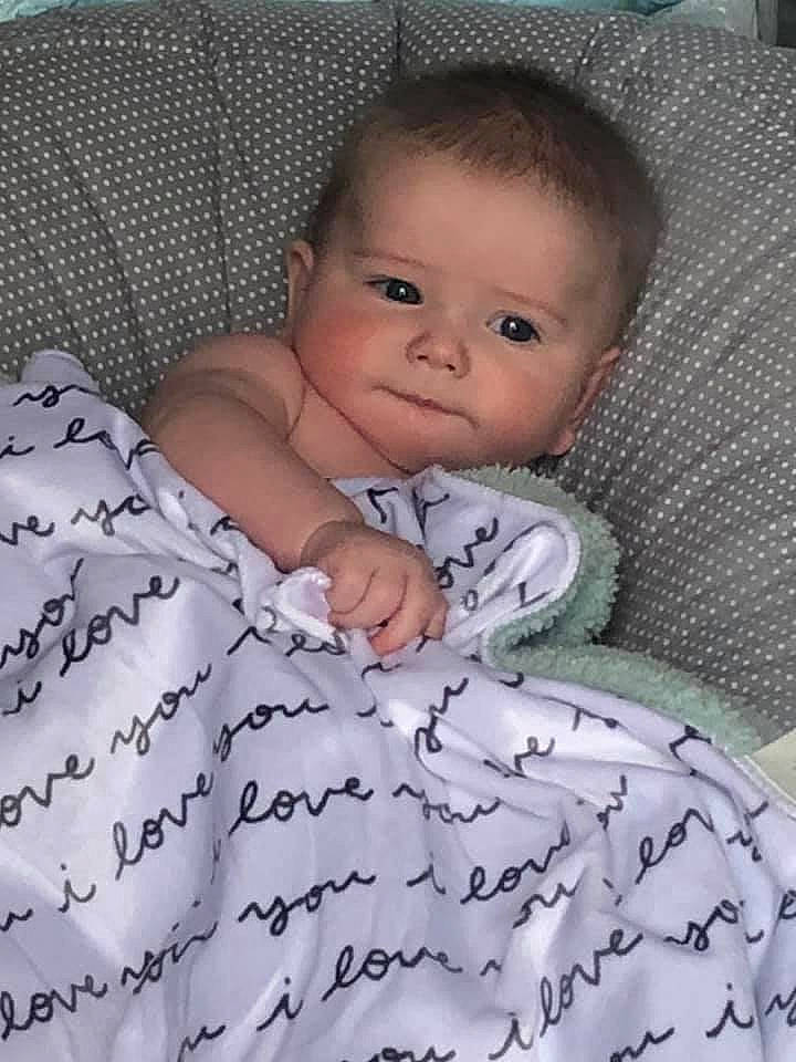 Finnegan joined the competition — help win amazing prizes! baby, baby_toddler_clothing, bedding, cheek, child, comfort, grey, linens, pattern, person, portrait_photography, room, sitting, skin, sleeve, textile, toddler