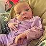 Jovi joined the competition — help win amazing prizes! baby, infant, purple_onesie, animal_print, cushion, bedding, fan, indoor, person, face, hand, curious, closeup, expression, comfortable, soft_lighting, newborn, portrait, relaxing, casual