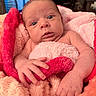 Jovi is registered to the contest to win money with this photo: baby, infant, blanket, pink, red, soft_texture, wrapped, curious, wide_eyes, skin, hand, face, portrait, indoors, cozy, newborn, cute, comfort, warm, expression