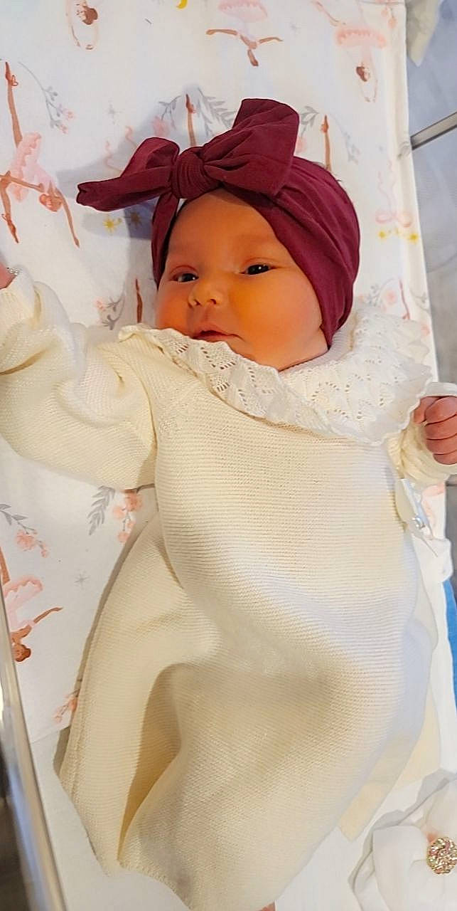 Rosemary is registered to the contest to win money with this photo: baby, beanie, cap, chest, child, doll, eye, eyelash, fashion_accessory, fashion_design, fur, headgear, headwear, knit_cap, linens, lip, peach, person, scarf, sleeve