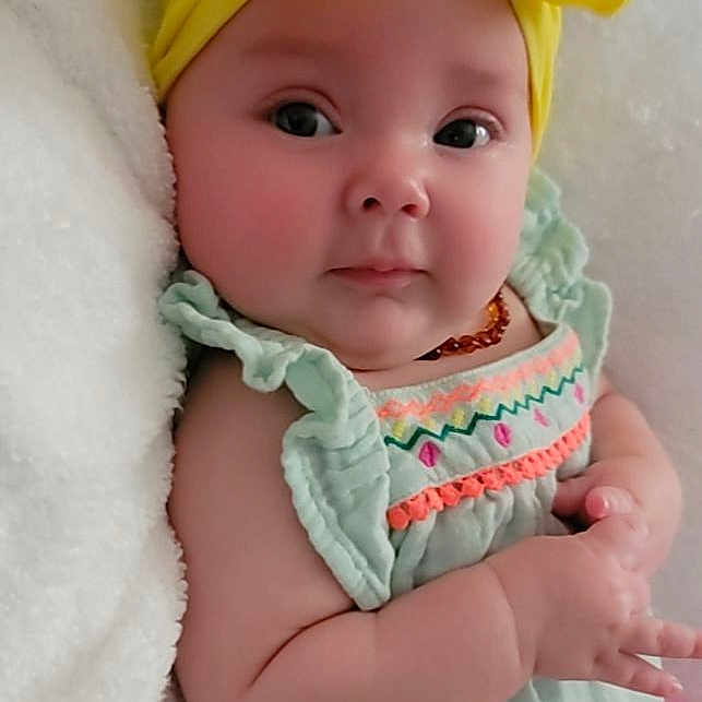 Rosemary joined the competition — help win amazing prizes! baby, baby_products, baby_toddler_clothing, cap, cheek, child, costume_hat, dress, fashion_accessory, hair_accessory, happy, hat, headgear, linens, pink, skin, sleeve, textile, toddler, yellow