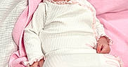 Wrenley is registered to the contest to win money with this photo: baby, infant, smiling, pink_bow, blanket, white_outfit, headband, lying_down, happy, portrait, child, cute, soft_texture, indoors, cozy, social_media, story, screen, mobile_interface, closeup