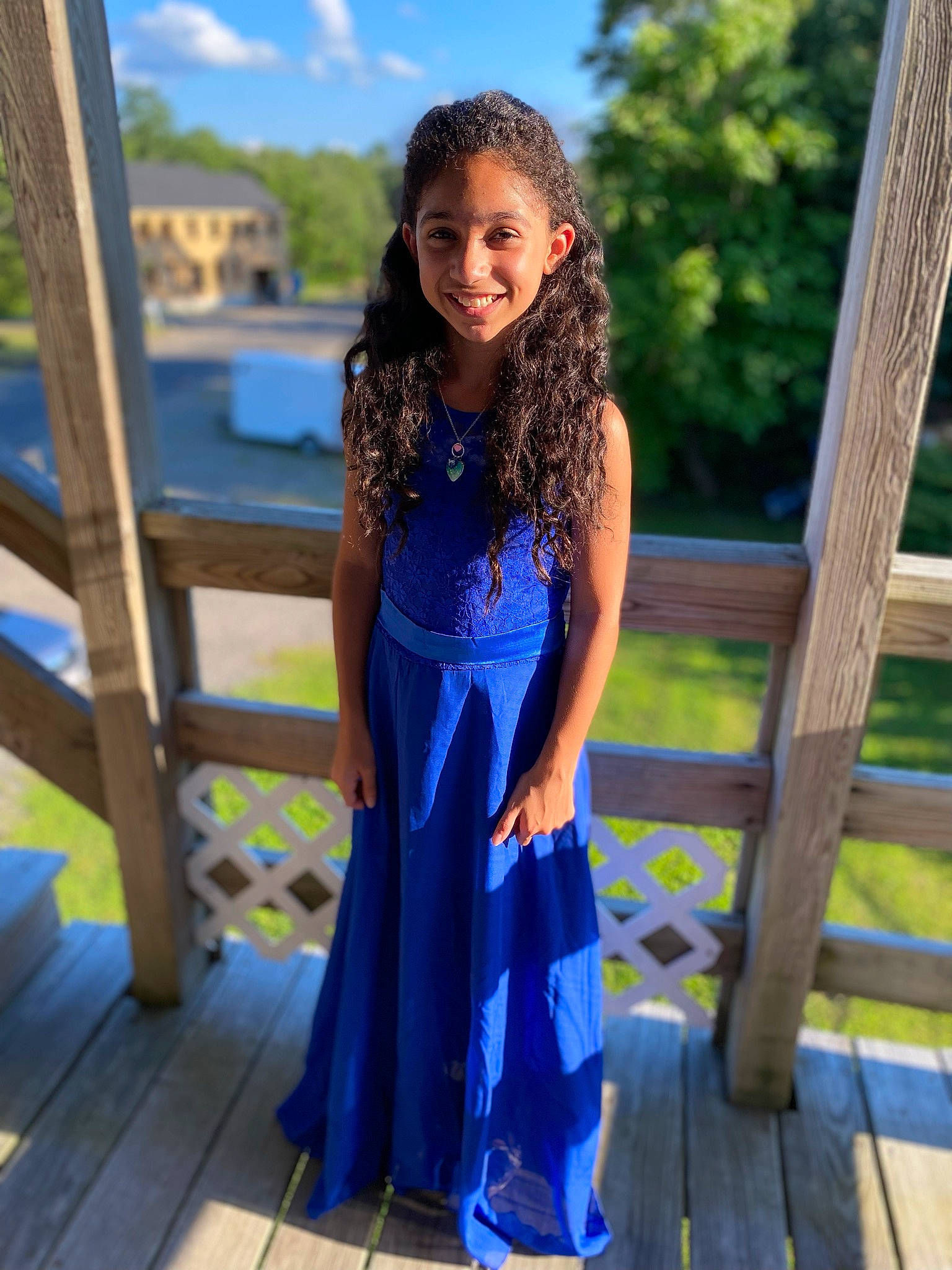 Ariah is registered to the contest to win money with this photo: abdomen, azure, black_hair, day_dress, electric_blue, event, fashion_design, formal_wear, grass, hair, happy, joy, leisure, long_hair, person, sky, smile, thigh, travel, tree