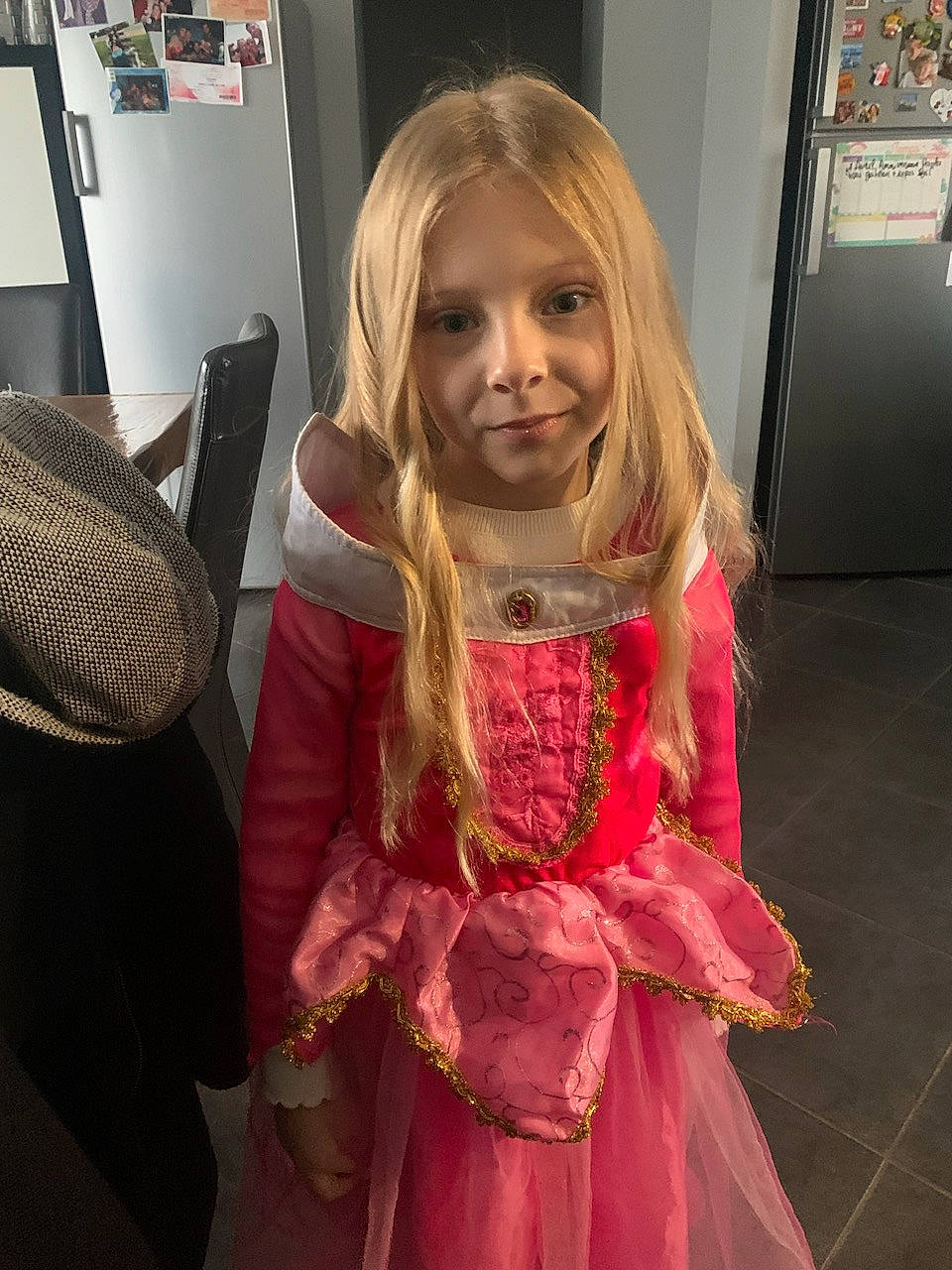 Alyssia participe au concours pour gagner de l'argent avec cette photo : dress, embellishment, facial_expression, floor, flooring, fun, hairstyle, iris, mammal, one_piece_garment, organ, people, person, pink, shoulder, skin, sleeve, smile, standing, toddler