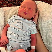 Colson Slade Howard joined the competition — help win amazing prizes! baby, blanket, child, clothing, cozy, cradled, cute, hand, indoor, infant, newborn, onesie, patterned_rug, peaceful, person, portrait, resting, skin, sleeping, tender