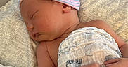 Colson Slade Howard joined the competition — help win amazing prizes! baby, blanket, child, comfort, cozy, cute, hands, hat, headwear, indoors, infant, newborn, peaceful, person, pillow, resting, skin, sleeping, soft, wrapped
