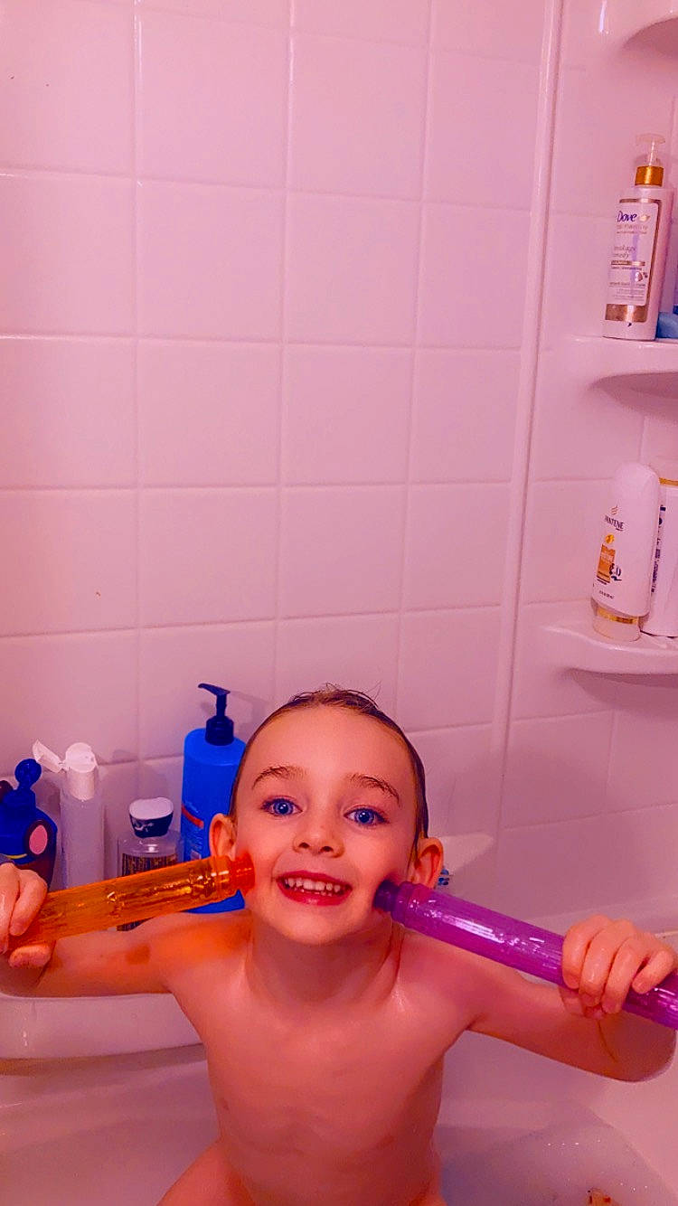 Gatlin joined the competition — help win amazing prizes! arm, bathing, bathroom, chest, finger, fun, hand, happy, human_body, joint, joy, muscle, person, personal_care, pink, plastic_bottle, plumbing, plumbing_fixture, purple, shoulder