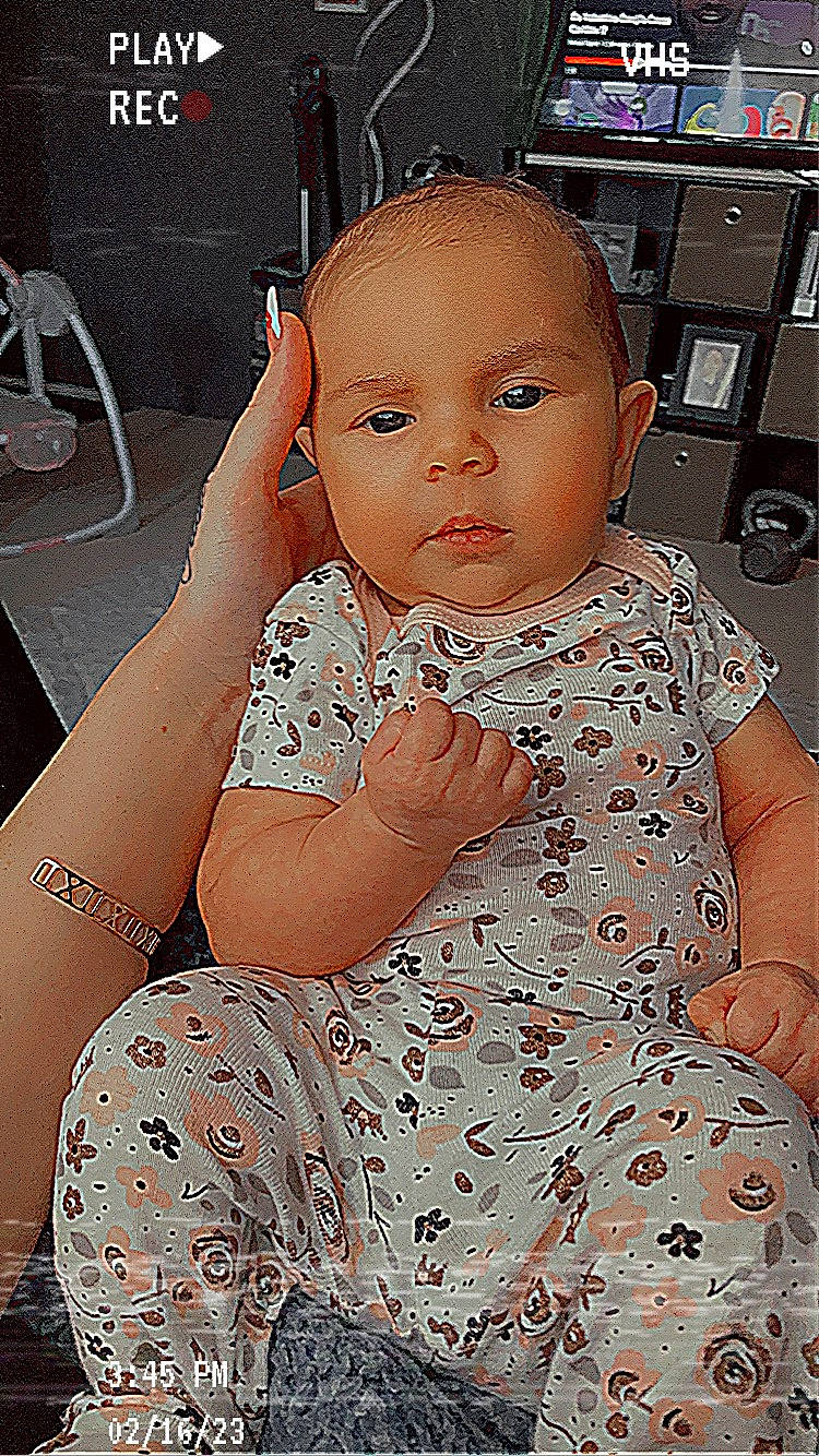 Love is registered to the contest to win money with this photo: baby, baby_toddler_clothing, cheek, day_dress, eye, eyelash, fashion_design, finger, flash_photography, gesture, happy, head, iris, joint, lip, nose, person, pink, skin, thumb