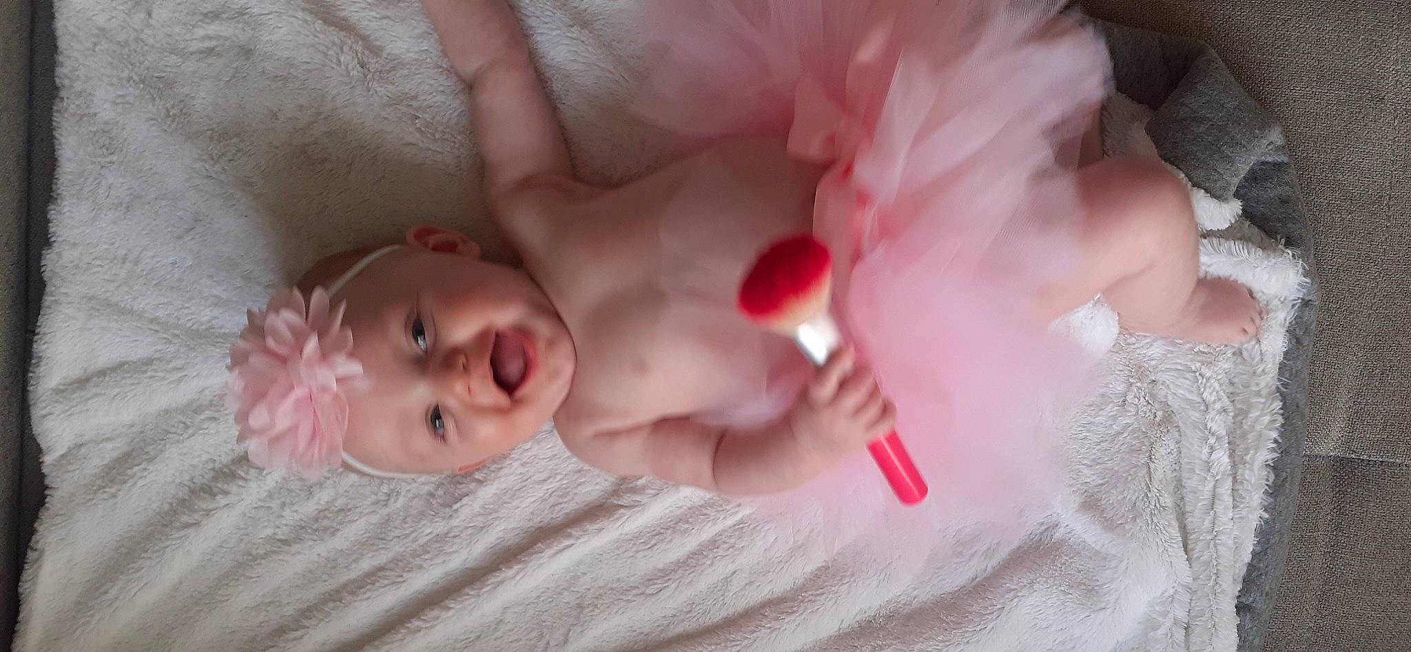 Mya participe au concours pour gagner de l'argent avec cette photo : arm, baby, comfort, dress, ear, eye, eyebrow, eyelash, face, finger, hair, hand, head, headgear, headwear, iris, lip, mouth, nose, person