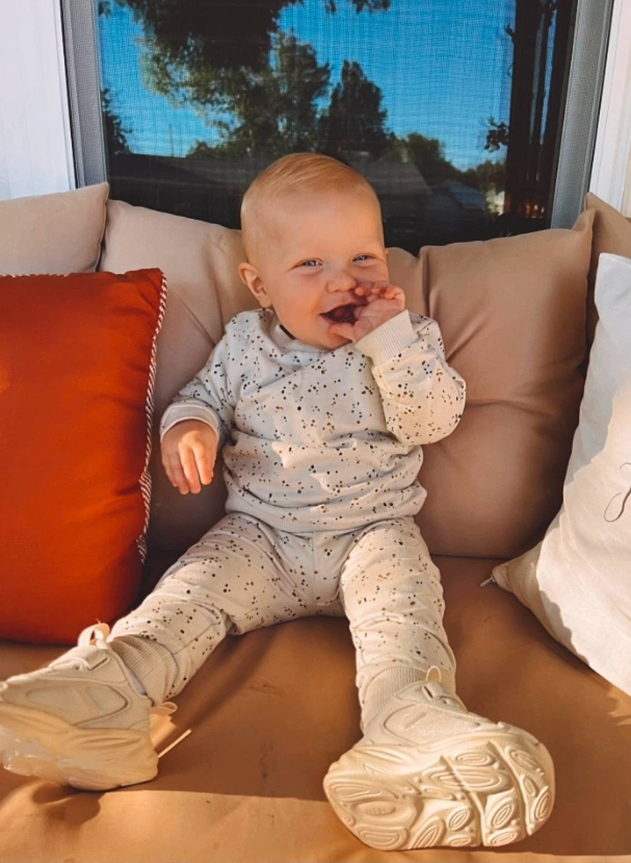 Gannon joined the competition — help win amazing prizes! baby, baby_toddler_clothing, comfort, couch, flooring, foot, fun, hairstyle, human_body, human_leg, knee, living_room, person, picture_frame, sitting, sleeve, sock, studio_couch, thigh, toddler