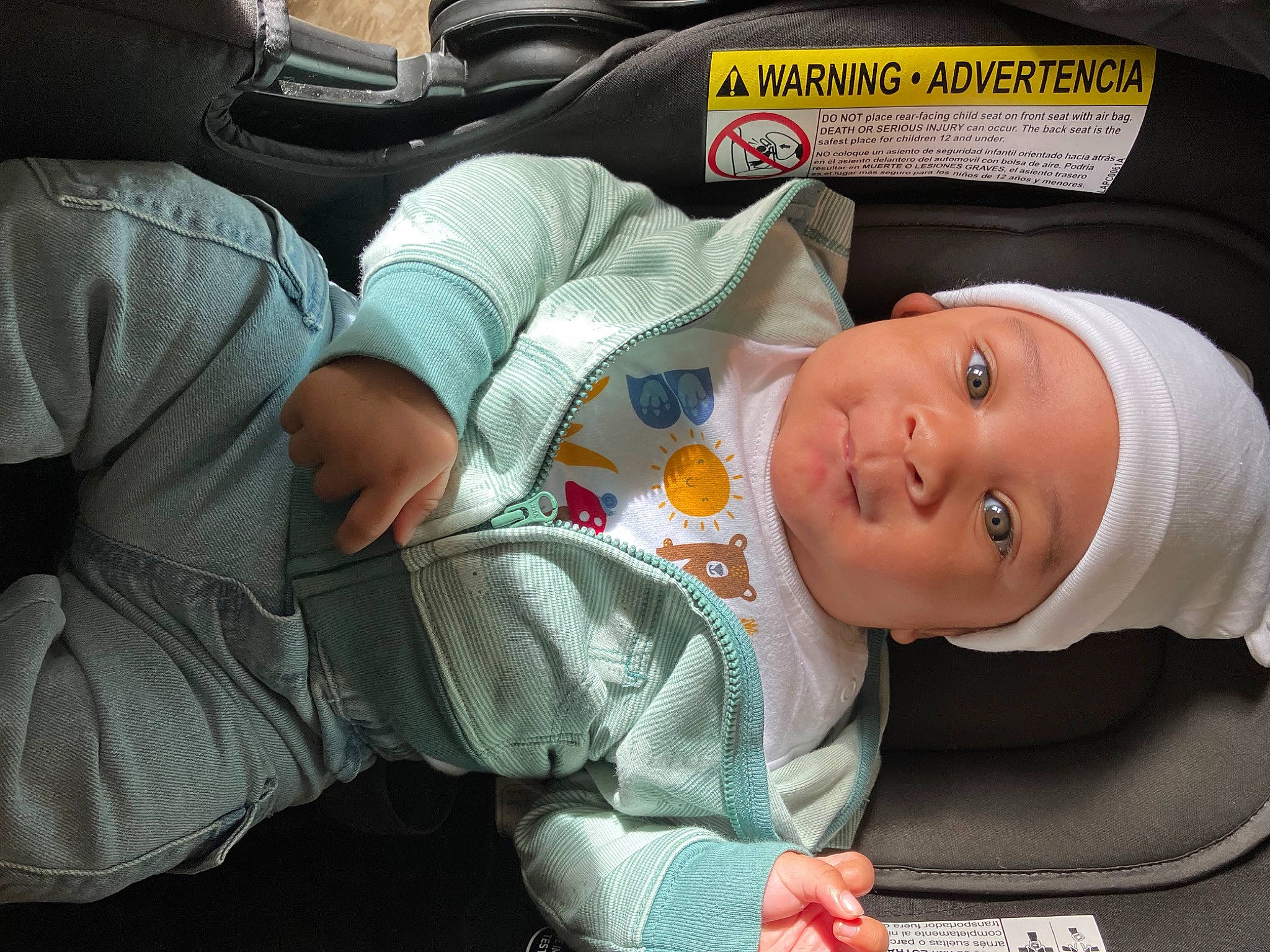 Jakobe is registered to the contest to win money with this photo: auto_part, baby, baby_carriage, baby_in_car_seat, baby_products, baby_toddler_clothing, car_seat, child, comfort, fun, headwear, mouth, nap, person, room, sitting, sleep, smile, toddler, tree