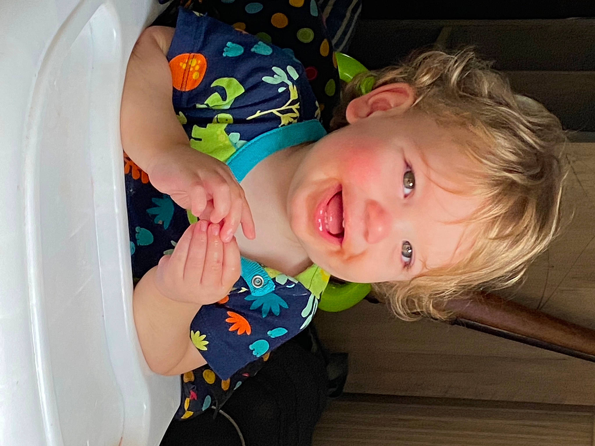 Konner is registered to the contest to win money with this photo: baby, baby_laughing, baby_products, baby_toddler_clothing, cheek, child, dress, fun, happy, iris, laugh, pattern, person, room, sitting, skin, sleeve, smile, toddler, wood