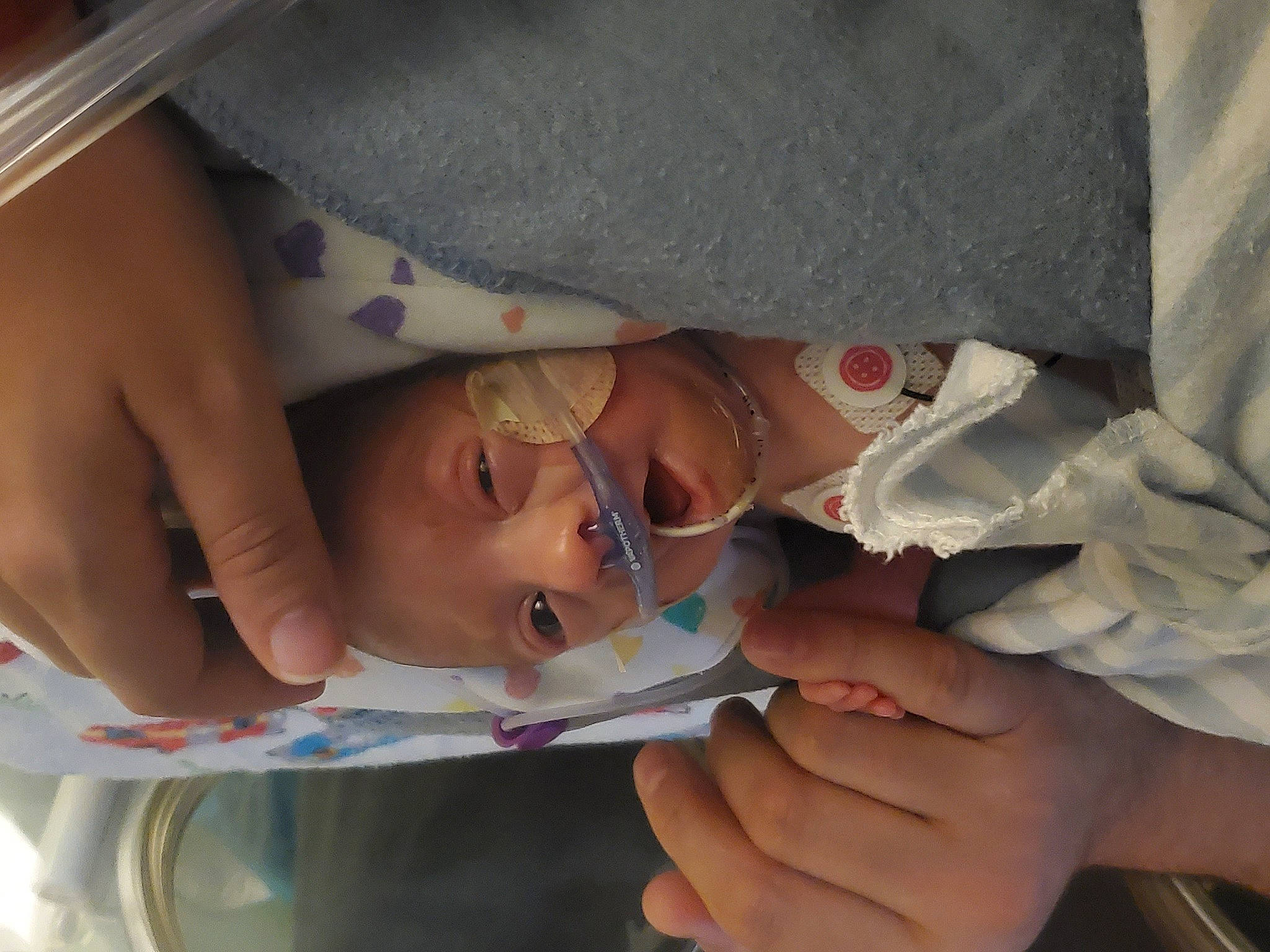 Xavior joined the competition — help win amazing prizes! baby, cheek, chest, child, eyelash, finger, gesture, hand, hat, head, health_care, medical_procedure, mouth, nail, nose, person, service, skin, thumb, toddler