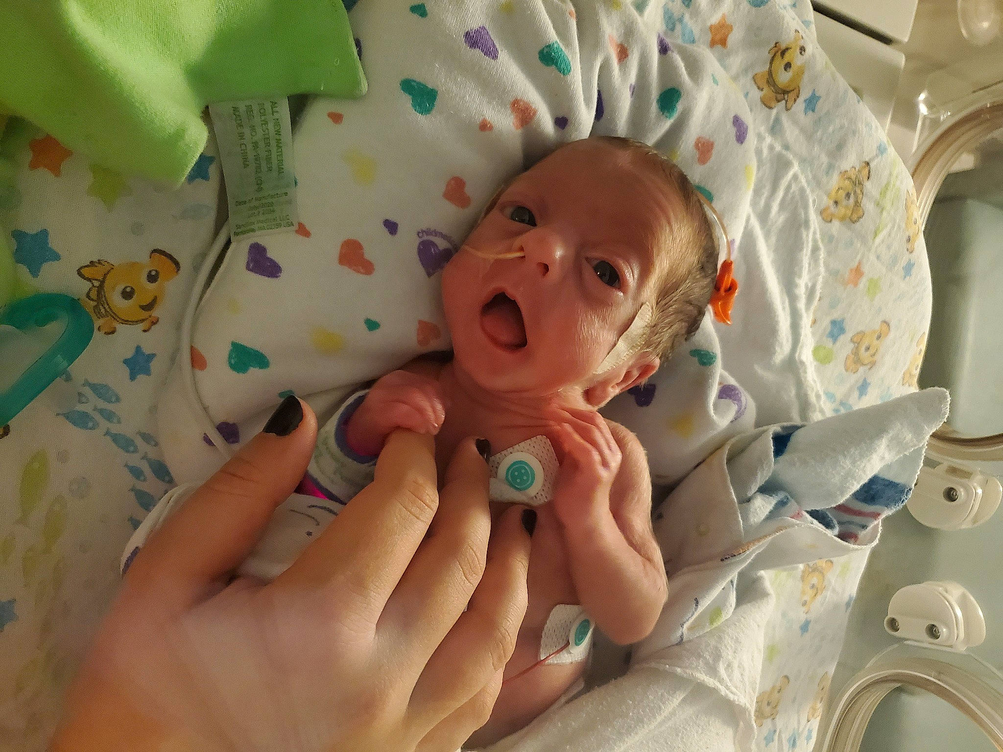 Xavior joined the competition — help win amazing prizes! baby, baby_safety, baby_toddler_clothing, cheek, child, comfort, finger, gesture, hand, health_care, hospital, medical, medical_equipment, mouth, person, product, service, skin, textile, thumb