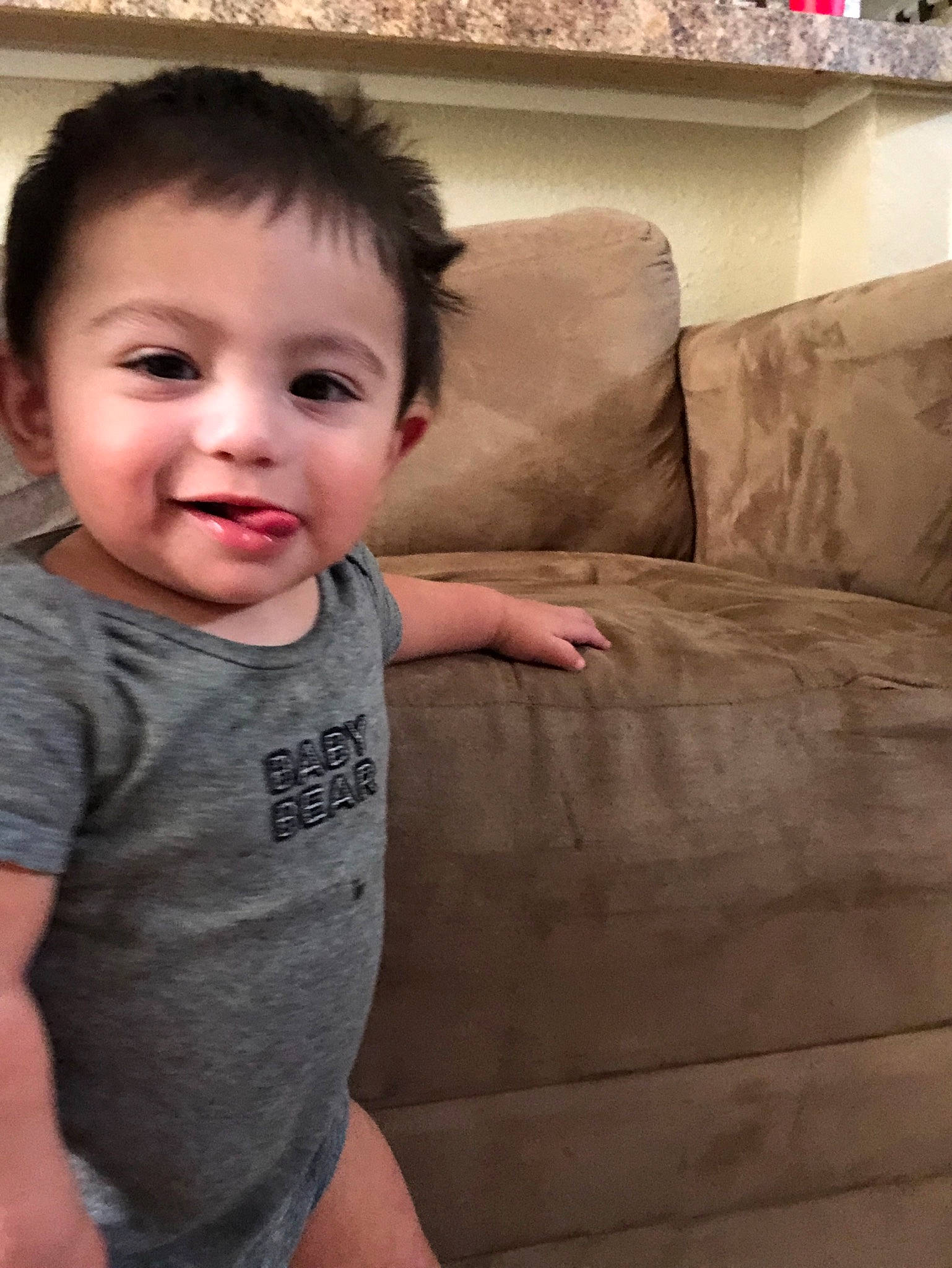 Osman is registered to the contest to win money with this photo: arm, baby, cheek, child, chin, ear, eye, face, facial_expression, forehead, head, joy, leg, mouth, nose, person, sitting, skin, smile, standing