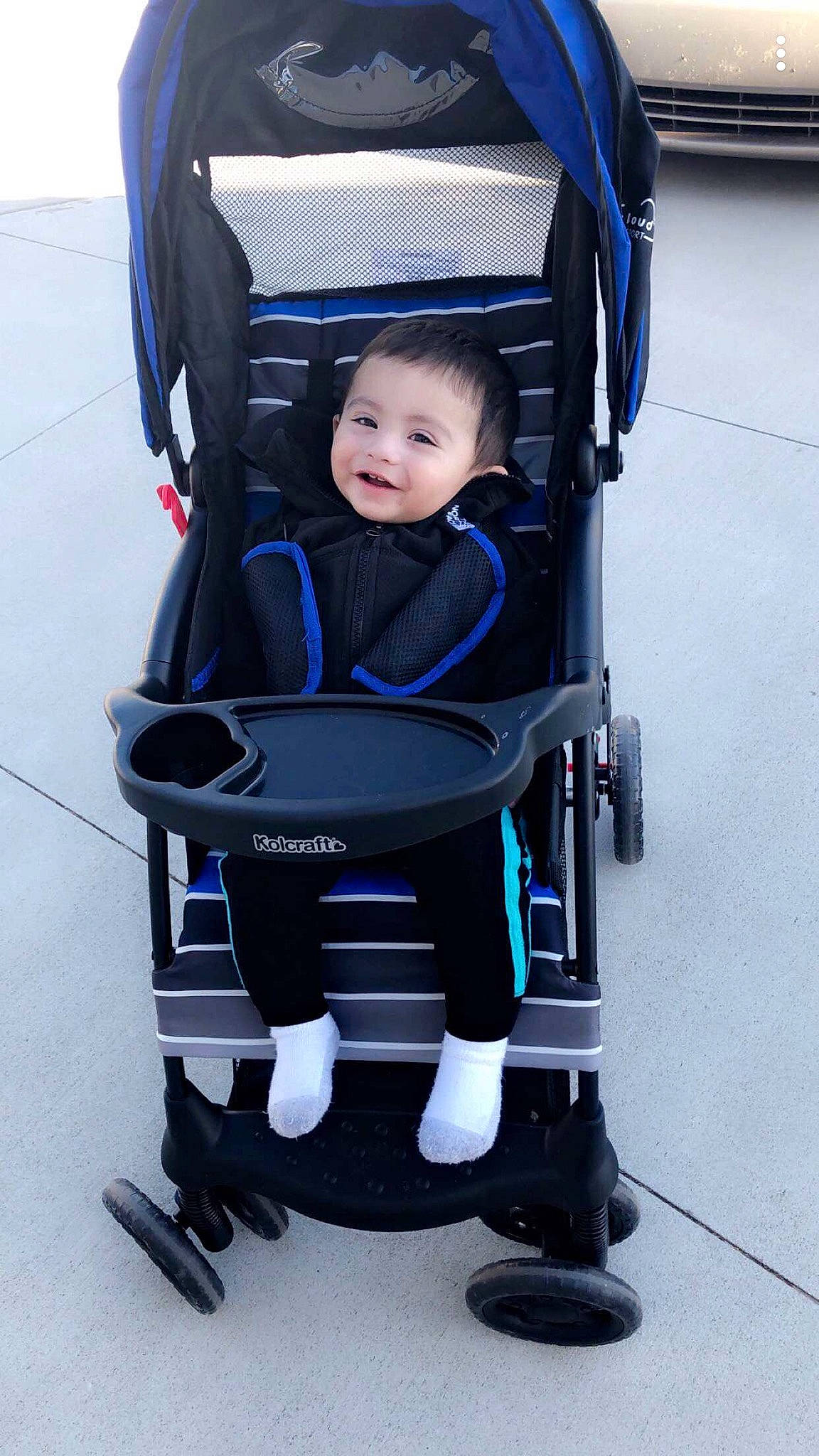 Osman is registered to the contest to win money with this photo: baby, baby_carriage, baby_products, chair, child, electric_blue, person, product, toddler