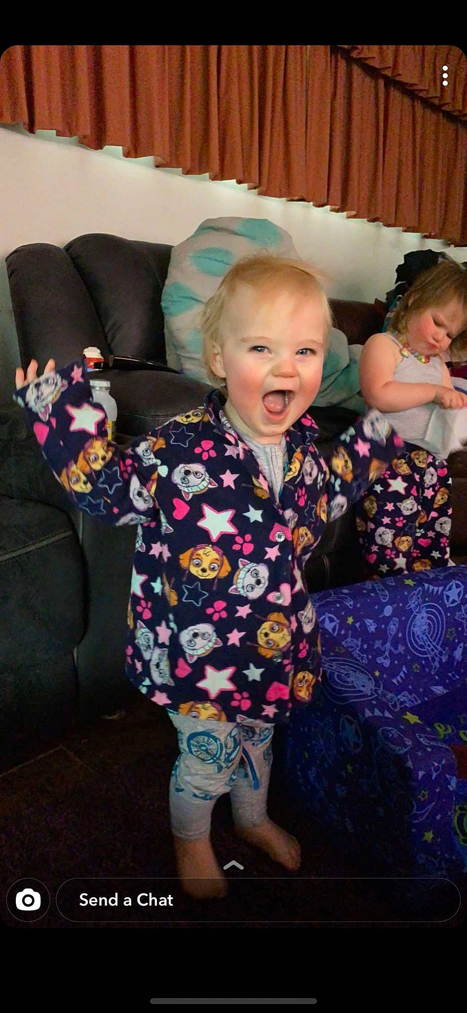 Kristian joined the competition — help win amazing prizes! baby, baby_toddler_clothing, child, comfort, couch, curtain, eye, face, head, home, human, human_body, lap, living_room, mouth, nightwear, nose, person, sock, toddler