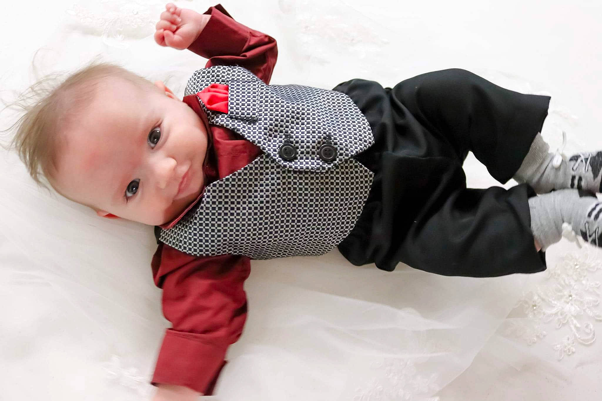 Tyler joined the competition — help win amazing prizes! baby, baby_sleeping, baby_toddler_clothing, bedding, carmine, child, collar, comfort, fashion_accessory, fur, human_leg, knee, linens, pattern, person, plaid, sitting, sleeve, textile, thigh