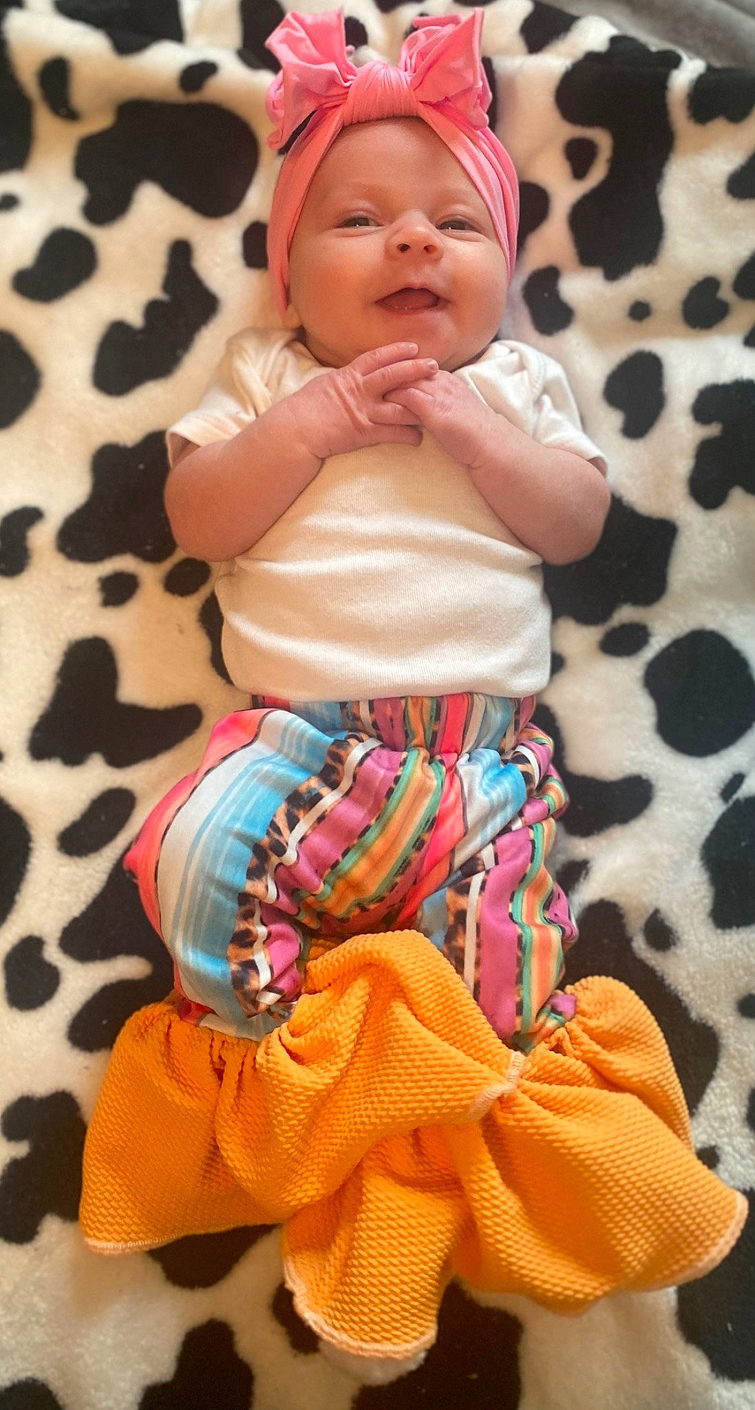 Brooklynn is registered to the contest to win money with this photo: abdomen, arm, baby, baby_toddler_clothing, cheek, child, hand, happy, human_body, magenta, pattern, peach, person, pink, skin, sleeve, textile, thigh, toddler, trunk