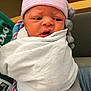 newborn, baby, infant, hat, blanket, hospital, gloved_hand, person, cloth, swaddle, face, expression, pink_stripes, white, holding, indoor, portrait, cute, newborn_baby, medical