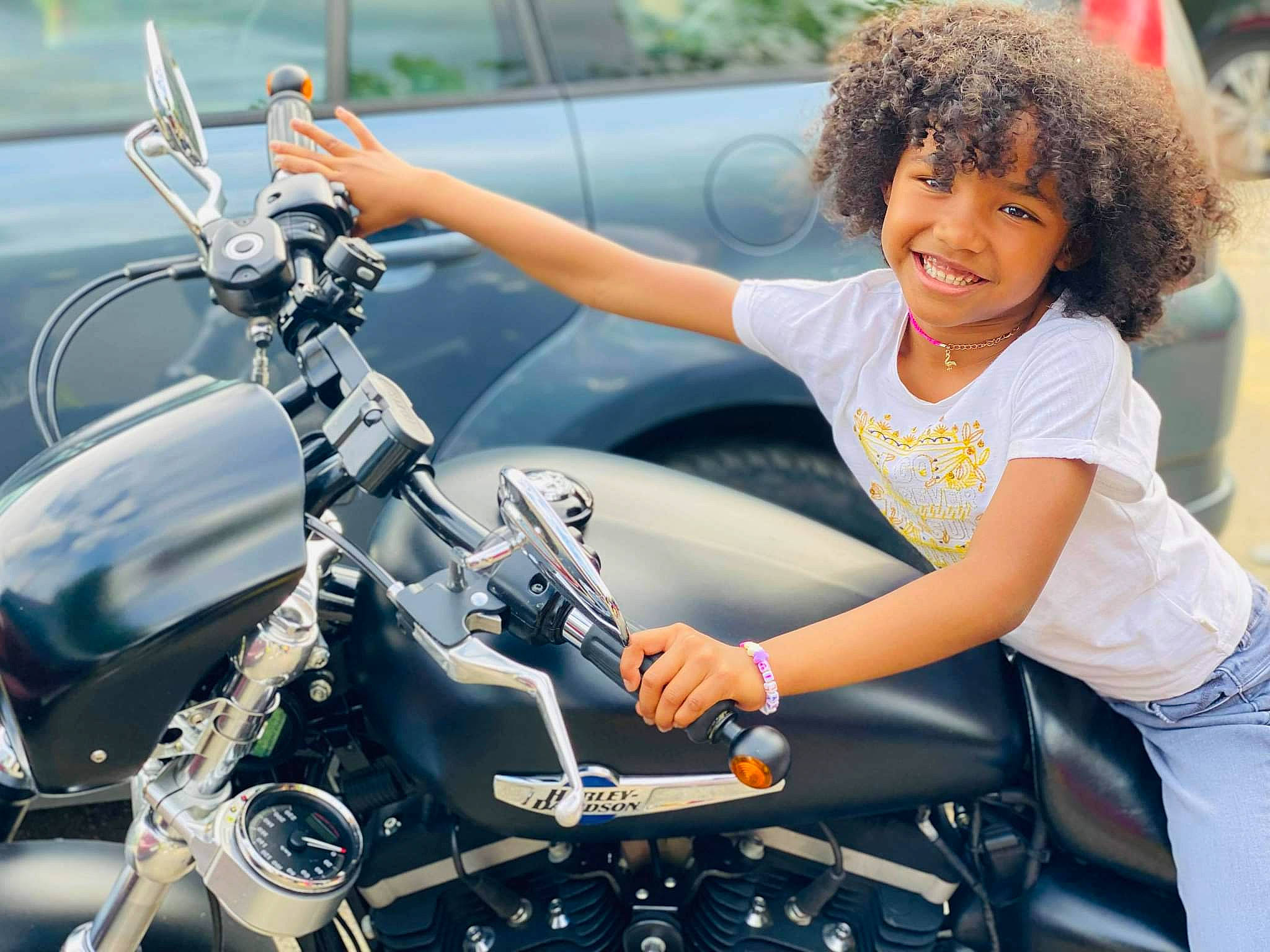 Shayli participe au concours pour gagner de l'argent avec cette photo : automotive_design, automotive_exterior, automotive_lighting, automotive_tire, bicycle_handlebar, black_hair, cool, fender, fuel_tank, hairstyle, happy, headlamp, human, joy, leg, mode_of_transport, motor_vehicle, motorcycle, person, photograph