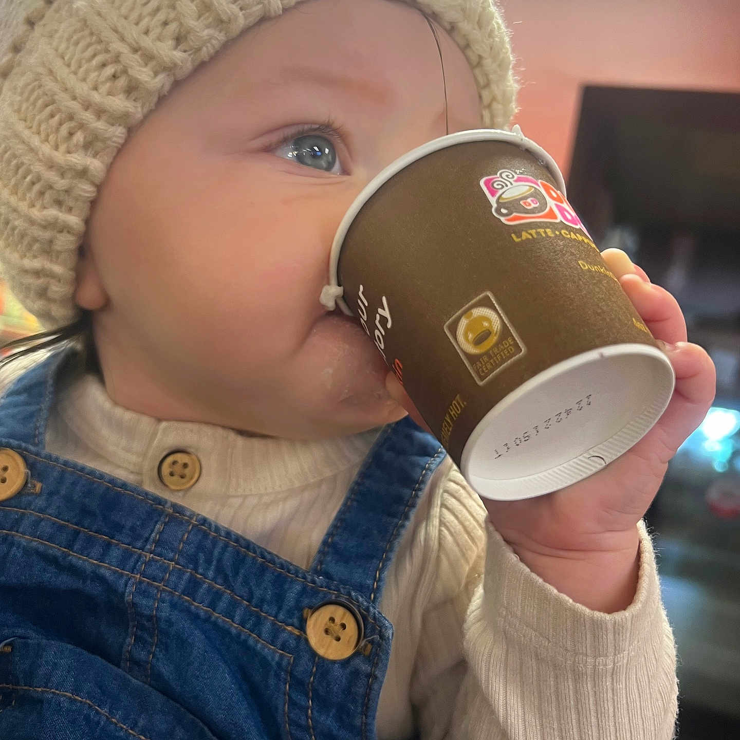 Ivory is registered to the contest to win money with this photo: alcohol, baby, beverage, bodypart, cap, clothing, cream, cup, dessert, disposablecup, drinking, drinkingalcohol, face, finger, food, hand, hat, head, icecream, person